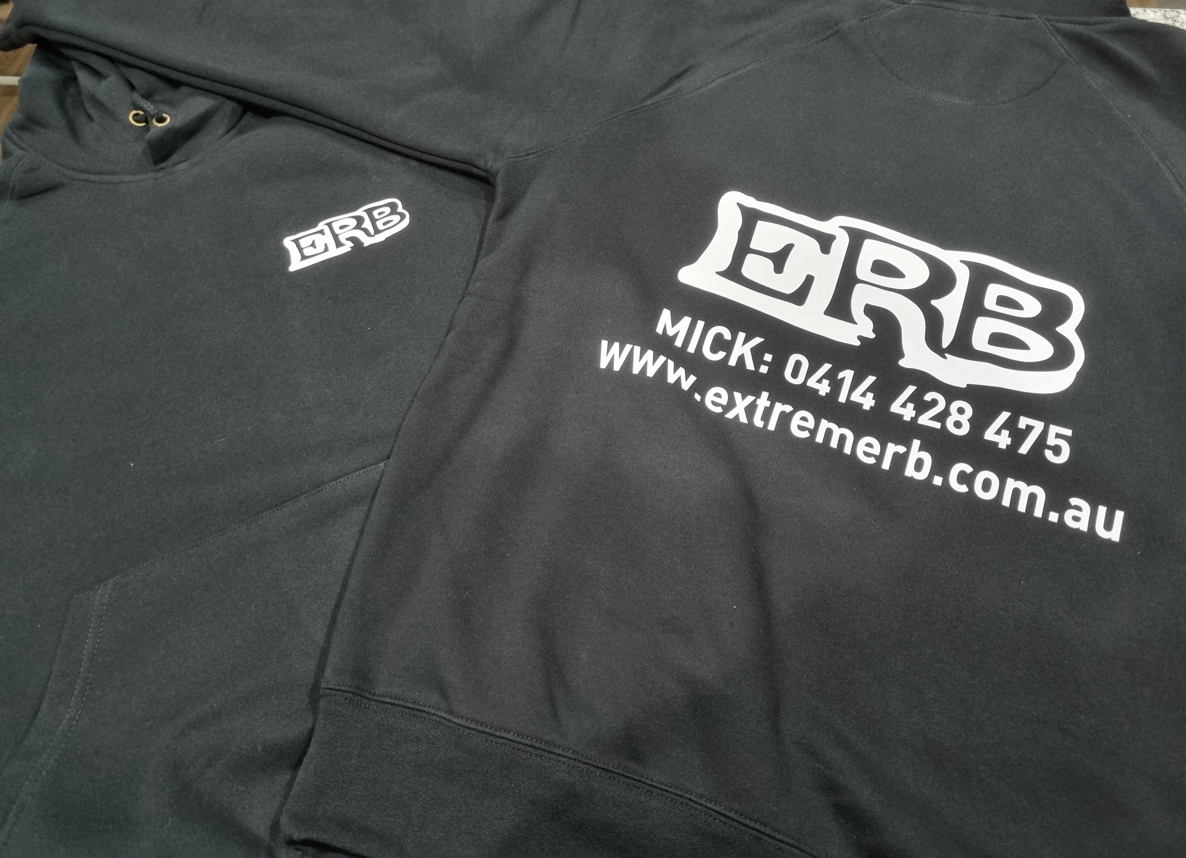 Black hoodie with white text and logo on a plain background